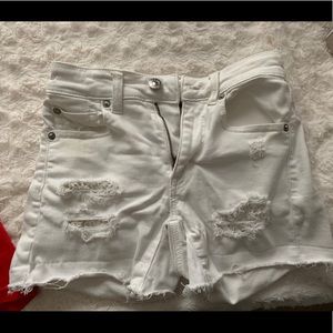White ripped jean shorts